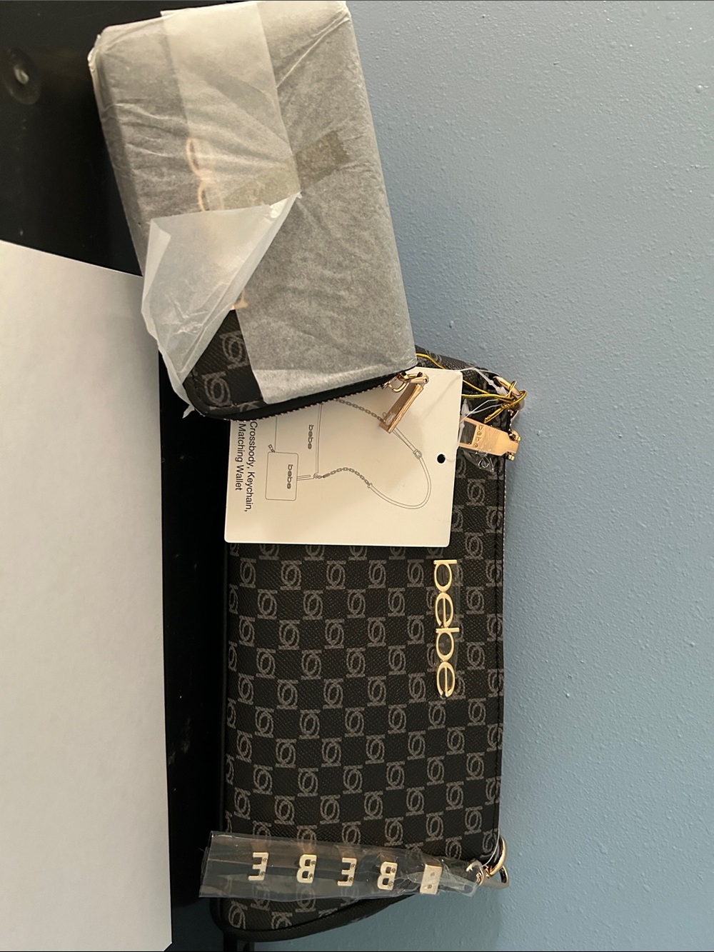 bebe Black Monogram Wristlet with Gold Logo